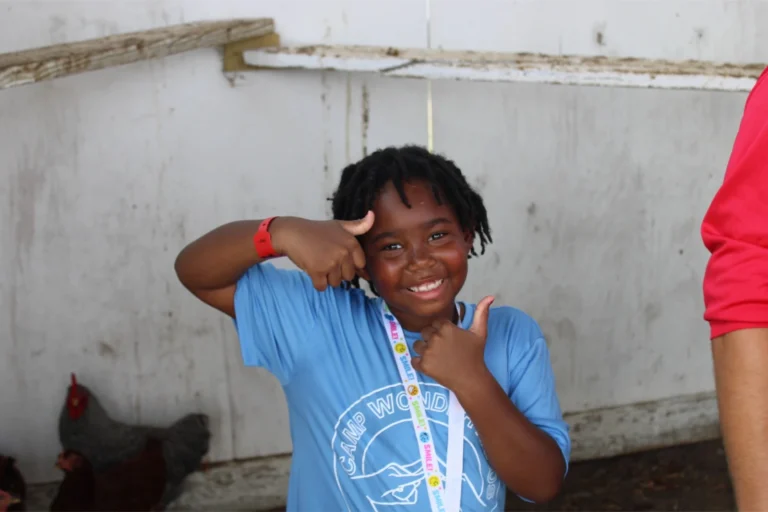 A camper gives two thumbs up