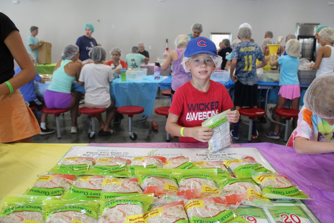 A Camper prepares a care package as part of service in Cole's Kids