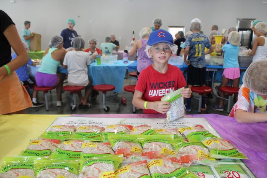 A Camper prepares a care package as part of service in Cole's Kids